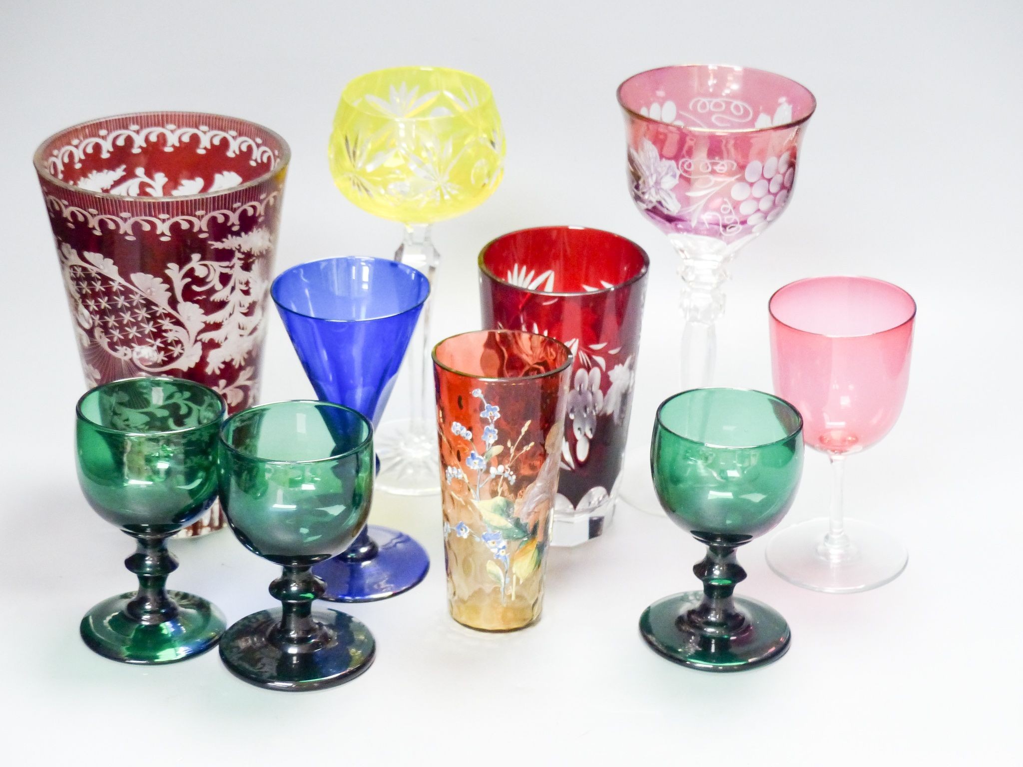 A collection of mixed 19th/20th century coloured drinking glasses, tallest 20cm